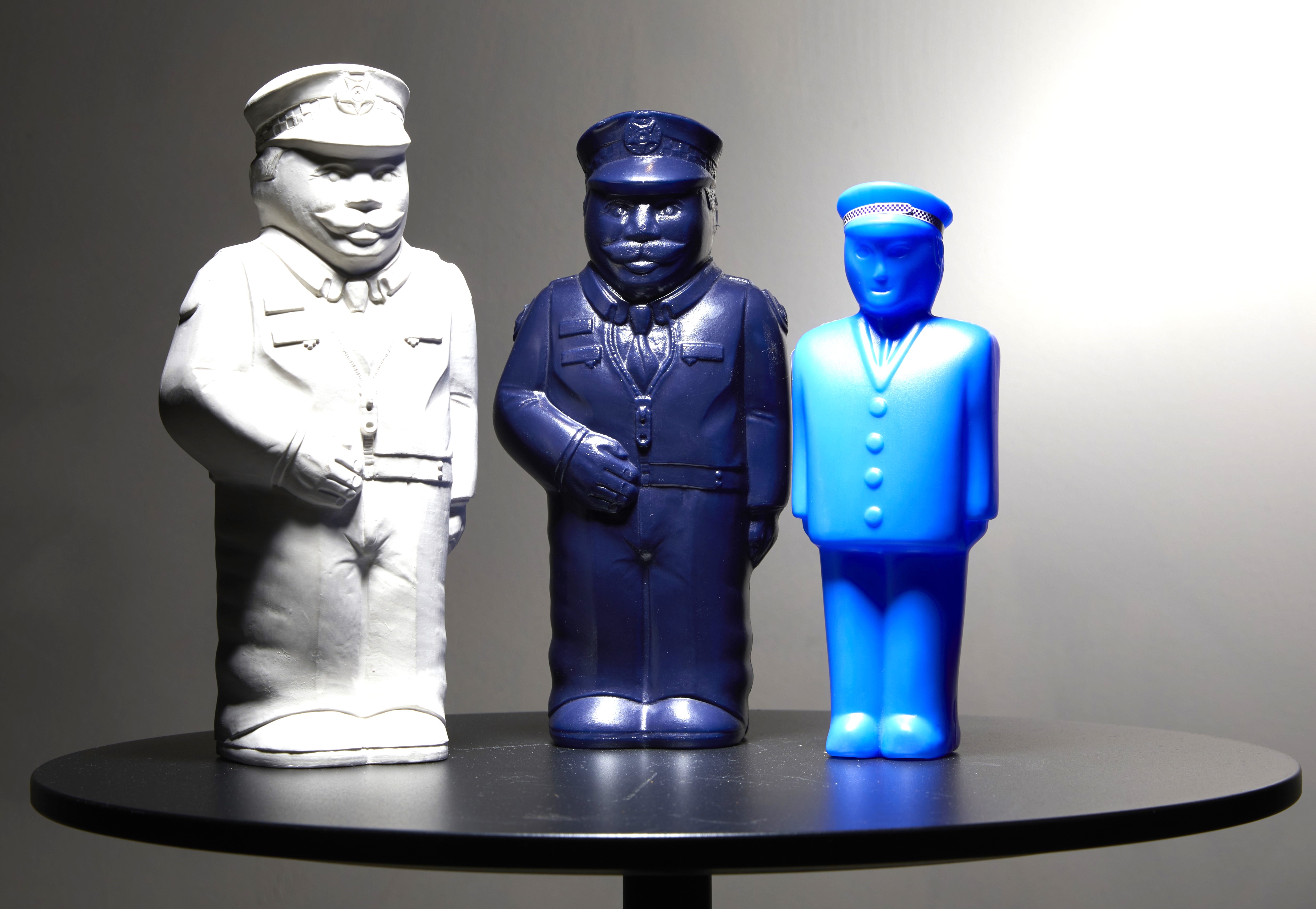 A photo of three iterations of the Little Copper money box from the Police Credit Co-op (now BankVic)'s savings program for children.